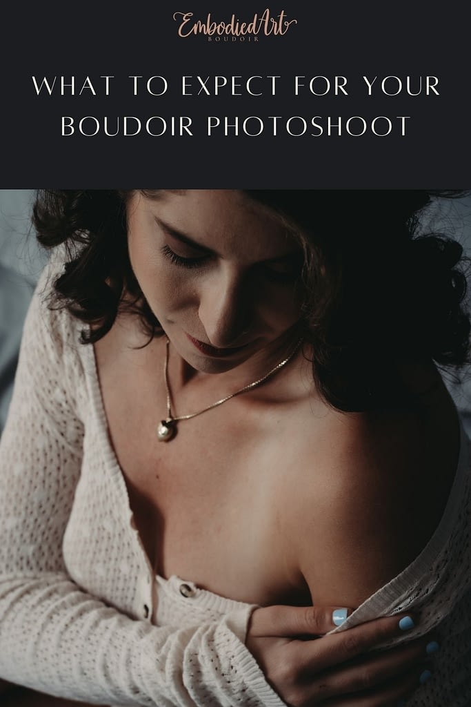 Blog Post: What to Expect For Your Boudoir Photoshoot Featuring a woman slyly pulling her cardigan down her arm, revealing a bare shoulder. Photo by Embodied Art Boudoir, Colorado boudoir photography, boudoir photo session, boudoir photoshoot, lingerie, happy women, confident women, art photography, body as art, boudoir, portrait, boudoir poses, empowerment through photography, natural hairstyles, empowering photography, professional hair and makeup, self love photoshoot, body positive, self care, luxury photoshoot, confidence, first boudoir photoshoot