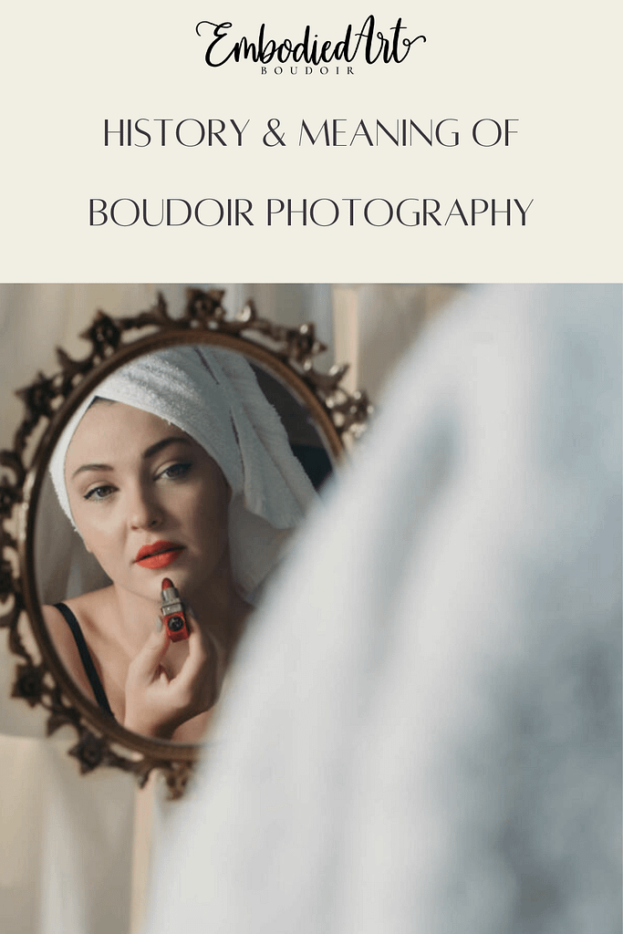 Woman looking softly into an antique mirror with a towel on her head, applying red lipstick. Photo by Embodied Art Boudoir. Boudoir photography, boudoir photos, denver boudoir, colorado boudoir, denver boudoir photographer, pinup, pin up, pin-up, boudoir studio, boudoir session, sensual photography, fine art nude photography, fine art nudes, boudoir, boudoir history, photography history, 70s photography, 70s photoshoot 