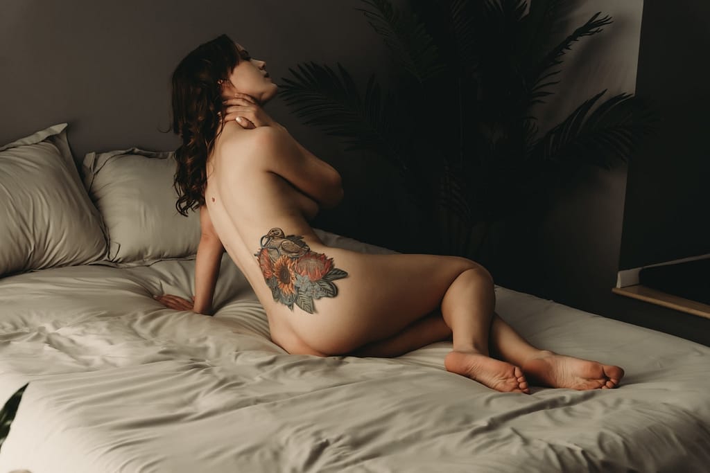Naked woman lying on bed with colorful tattoo showing. Photo by Embodied Art Boudoir. Boudoir outfits, boudoir lingerie, boudoir fashion, boudoir babes, boudoir inspo, boudoir fashion, boudoir dress, boudoir style, personal style, favorite outfits, blogging, boudoir ideas, lingerie, colorado boudoir, boudoir, denver boudoir, denver boudior, boulder boudoir, colorado springs boudoir, boudoir ideas, photoshoot accessories, outfit inspiration, photoshoot outfit 