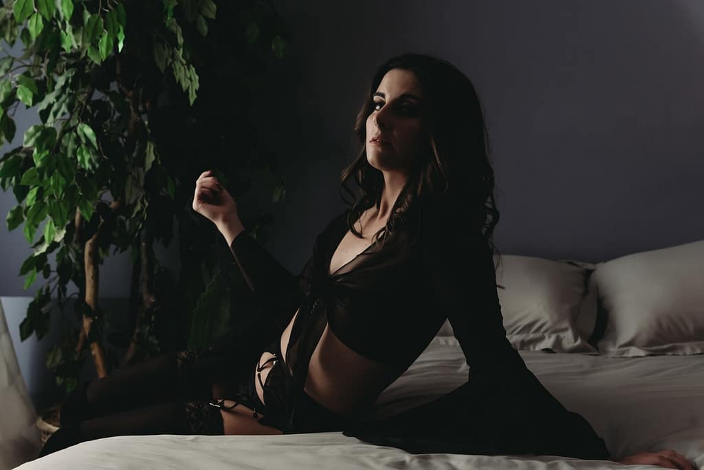 Woman sitting on edge of bed wearing a black two piece outfit. Photo by Embodied Art Boudoir. Affirmations, Affirmation Cards, mindfulness, confidence, self love, self love journey, affirmation practice, daily routine, self care routine, self care, female empowerment, self confidence, self worth, the body deck, connection, shop online, cards, body positivity, boudoir photoshoot, colorado boudoir, denver boudoir, boulder boudoir, colorado springs boudoir, boudoir inspiration, photography inspiration