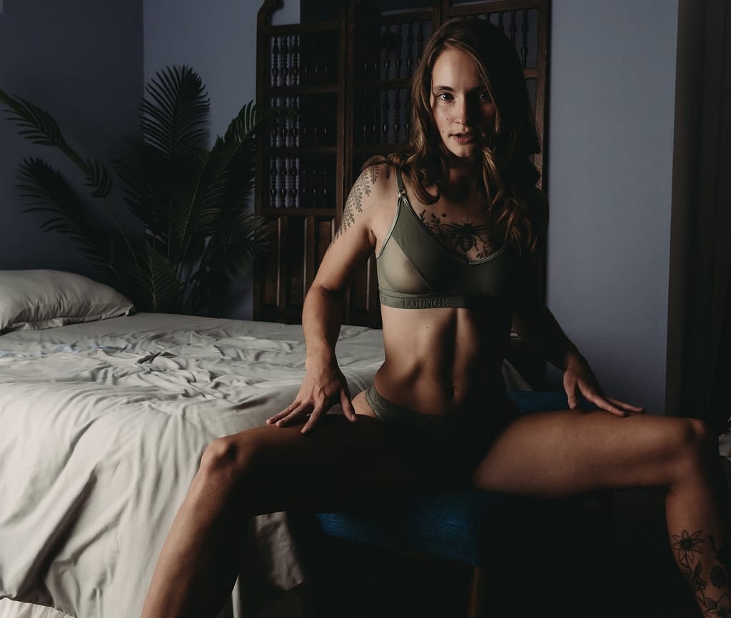 Woman sitting confidently at the edge of bed, wearing a green see through bra and matching panties. #SelfCare #Deserving #Photoshoot #Confidence #ConfidenceBoost #ConfidentWomen #ConfidenceIsSexy#ConfidenceTips #Metime #empowerment #femaleempowerment #selfcarehacks #selflove #expressyourself #selfcareisntselfish #Colorado #boudoirphotos #boudoirpics #denverboudoir #denverboudoirstudio #boudoirinspiration #boudoirsession #coloradoboudoir #denverboudoirphotographer #boudoirphotoshoot #boudoir #femalephotographer