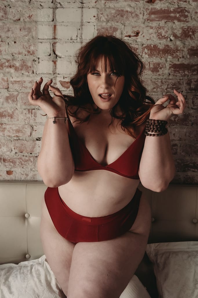 Woman standing wearing a matching red bralette and panties. Photo by Embodied Art Boudoir. A healthy relationship with food, mindful eating, love your food, non-judgemental, food freedom, anti-diet, self-compassion, mindfulness, self-love, dietary needs, slow down, appreciate food, appreciate life,  colorado boudoir, denver boudoir, boulder boudoir, colorado springs boudoir, boudoir ideas, boudoir poses, boudoir inspiration  