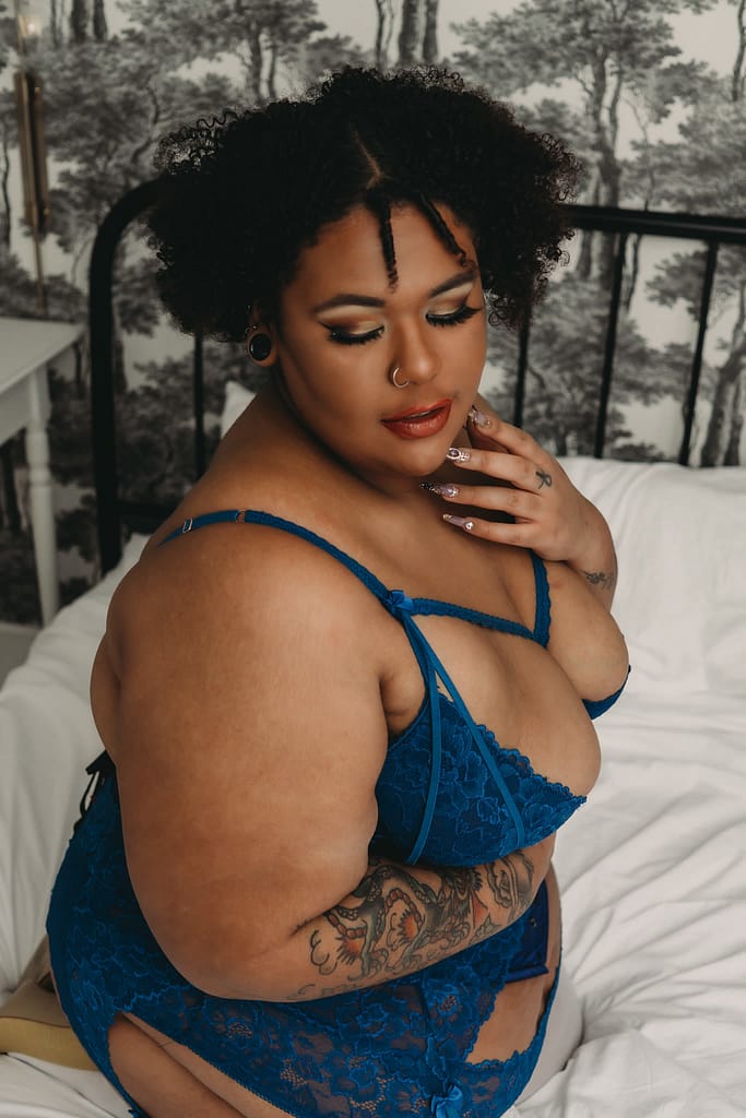 Woman kneeling on bed, wearing a matching baby blue bralette and panties. Photo by Embodied Art Boudoir. Curvy women, curvy girl style, plus size boudoir, plus size photography, plus sized women, fight the inner critic, self confidence, self love, love your body, stylish plus sized women, plus size lingerie, beautiful women, empowered women, photogenic, stunning boudoir images, boudoir imagery, boudoir picture, female photographer, denver boudoir, golden boudoir, golden colorado boudoir, boudoir inspiration 
