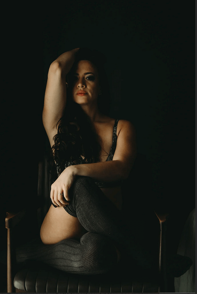 Woman sitting on a chair cross-legged wearing thigh high socks. Photo by Embodied Art Boudoir, cozy, cozy boudoir, cozy vibes, cozy outfits, cozy and comfortable, cozy boudoir photography, cozy inspiration, keep it cozy, boudoir outfit, boudoir outfit inspiration, what to wear to boudoir, colorado boudoir, denver boudoir, boulder boudoir, colorado springs boudoir, boudoir ideas, boudoir poses, boudoir inspiration, photography inspiration
